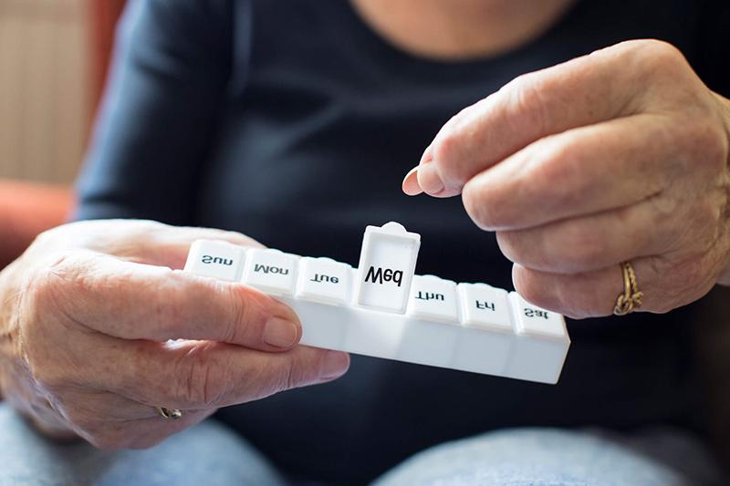 person sorting pills