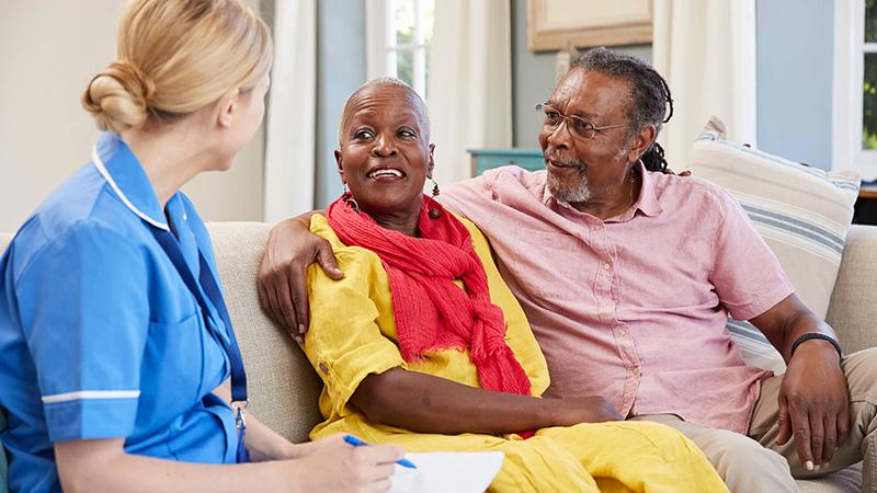 nurse talking to a couple